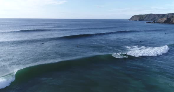 Surfers catching waves in ocean