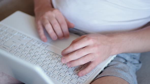 Man Freelancer Working on Laptop at Homeoffice