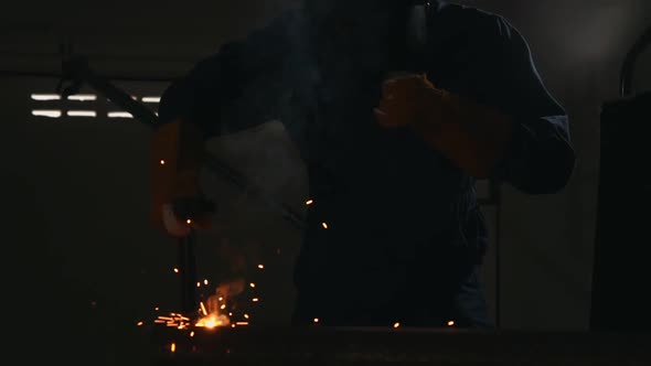 Metal Welder Working with Arc Welding Machine