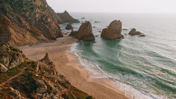 Aerial Drone View of Praia Da Ursa Beach in Sintra Portugal in Sunset Golden Hour Light