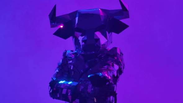 Shiny Bull in Costume Made of Mirrors Dancing Robot Dance on Neon Purple Studio Background