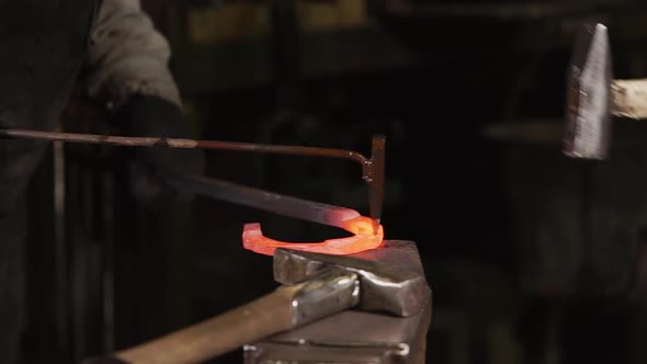 Close Up Shot of Forging Handmade, Men Make a Horseshoe Made of Steel