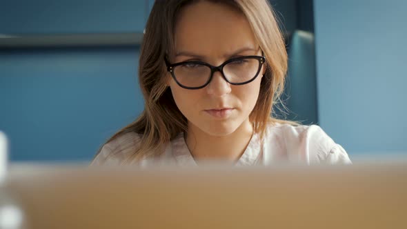 Woman Face Mimics While Using Computer