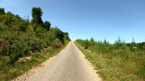 POV Driving on motorcycle on a scenic road in Eifel National Park in Germany