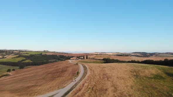 Aerial shot of rolling hills and valleys in golden evening light,Val d'orcia ,TUSCANY,ITALY