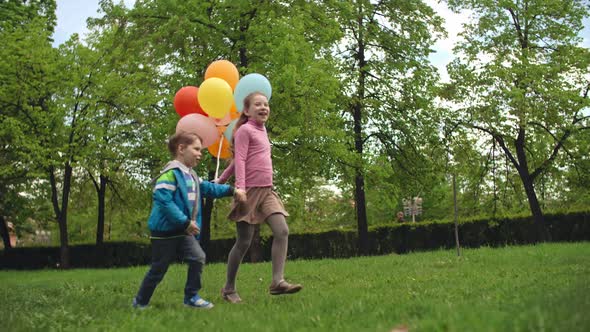 Carefree Children Running in Park