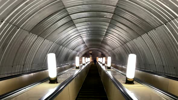 Empty Moving Downhill Escalator in the Subway