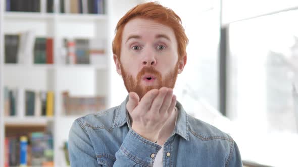 Flying Kiss By Casual Redhead Man