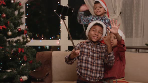 Three Kids Take Christmas Selfie.