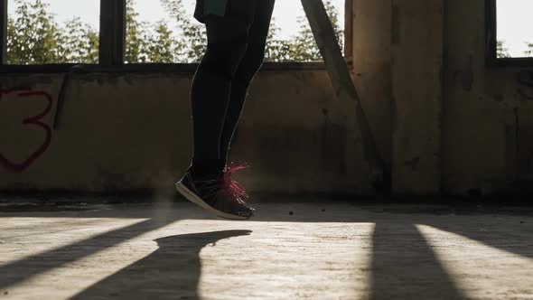 Legs of Male Boxer with Skipping Rope