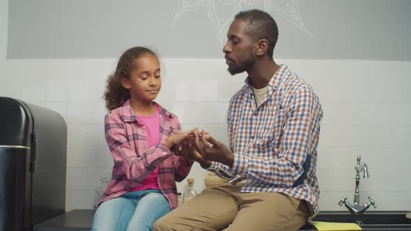 Loving Dad and Kid Sharing and Talking in Kitchen