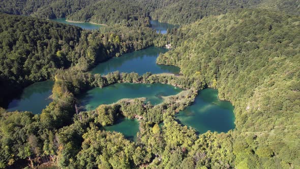 Flying over the famous Plitvice Lakes with forest at summer in Croatia, Europe