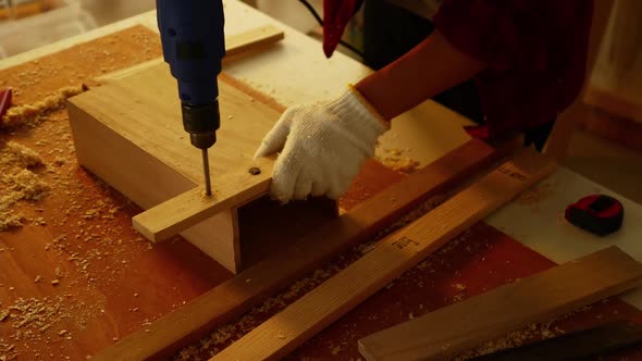 Woodwork and furniture making concept. Stylish craftsman working in his carpentry workshop