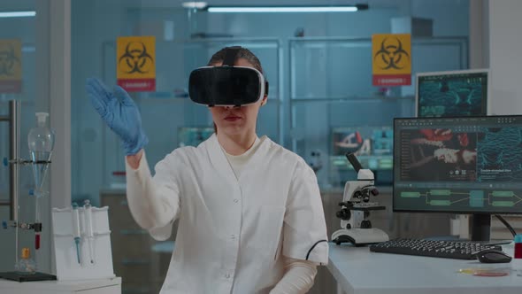 Chemist Working with Virtual Reality Headset in Laboratory