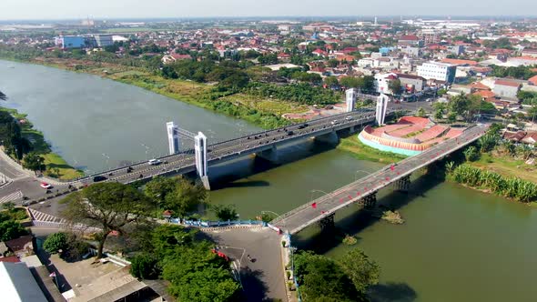 Panoramic aerial view of Brantas river and Brawijaya bridge in Kediri, Indonesia