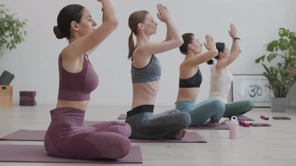 Group of Four Women Having Yoga Classes