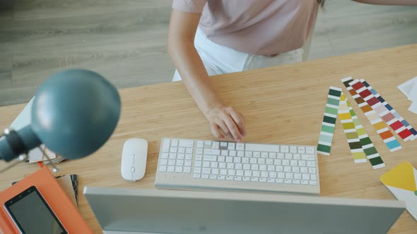 Slow Motion of Female Designer's Hands Working with Pc Looking at Smartphone Screen Design