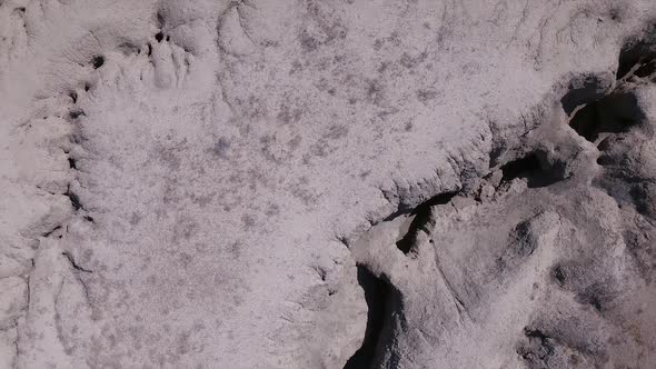 Aerial view looking down at eroded desert terrain