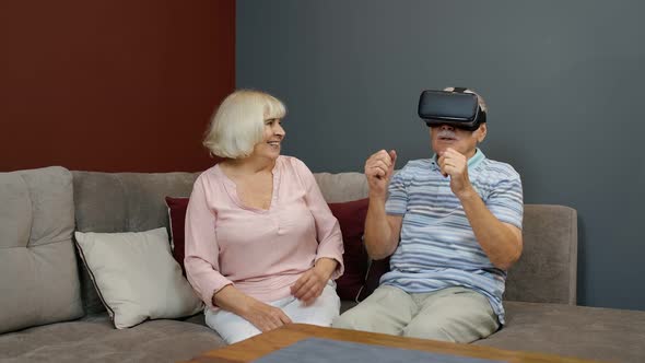 Grandfather and Grandmother with VR Headset Helmet Play Games, Watch Virtual Reality 3D 360 Video