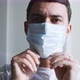 Married Young American Man Puts on a Medical Mask Closeup - VideoHive Item for Sale