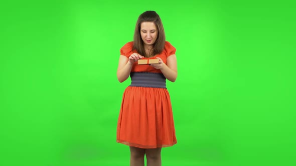 Cute Girl Is Opening the Gift, Very Surprised and Rejoicing. Green Screen