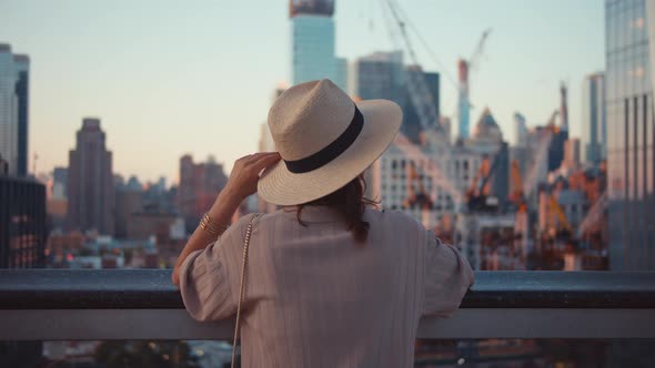 Young tourist with a hat on the roof in New York