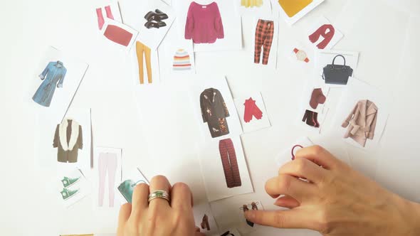 The Stylist Selects a Wardrobe Using the Example of Paper Decorations