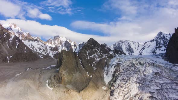 Tian Shan Mountains and Blue Sky with Clouds. Aerial View