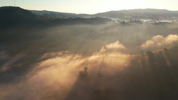 4K Drone Flying in the clouds. Flying through the clouds during sunrise