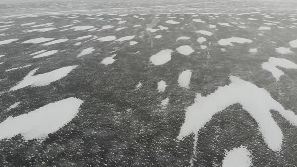 Snow Is Flying Over Surface of Ice