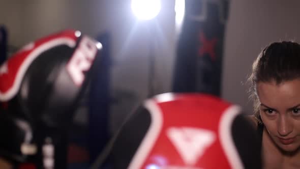 Two Female Boxers Sparring in the Ring