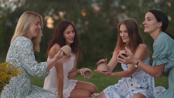 A Group of Young Attractive Women in Nature in the Field in the Park Sculpt From Clay Shape Products