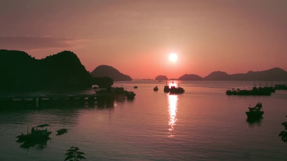 Fiery sunset over  the waters and mountains of Catba Island in Vietnam -aerial