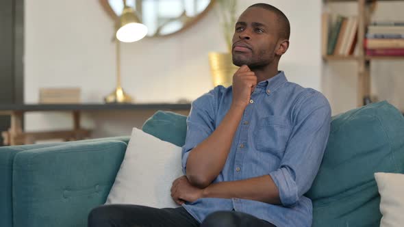 Worried Young African Man Thinking About Problems 