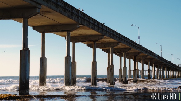 4K Pier on the Beach as Waves Crash on the Shore