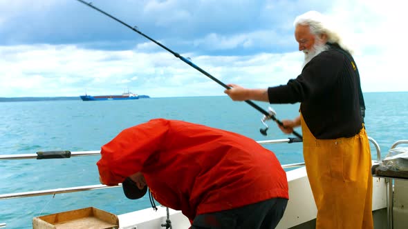 Fishermen fishing from the boat