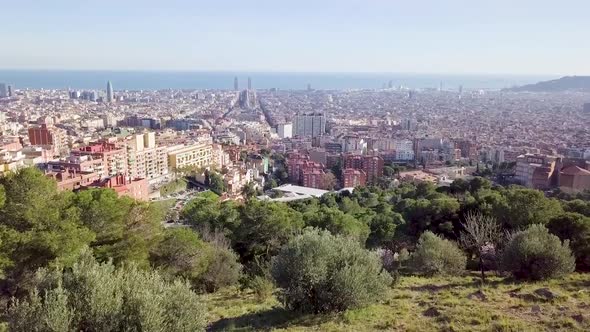 Barcelona Aerial View Of Cityscape. Top of the hill with trees.