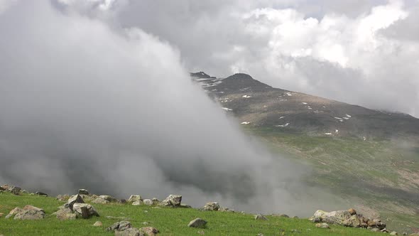 In the High Altitude Alpine Meadows Approaching Fog Covers