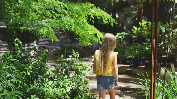 Little girl wandering in nature