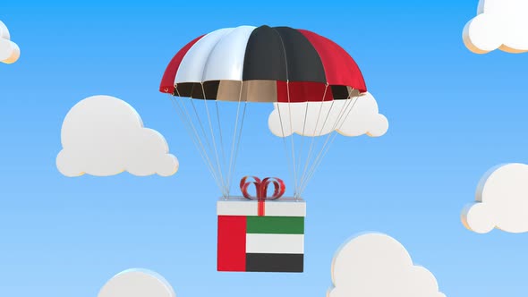 Carton with Flag of the United Arab Emirates UAE Falls with a Parachute