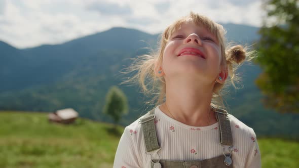 Portrait Little Girl Looking at Sky Standing Meadow