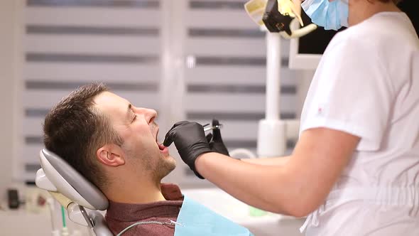 A person who treats teeth examined by a dentist, healthy teeth