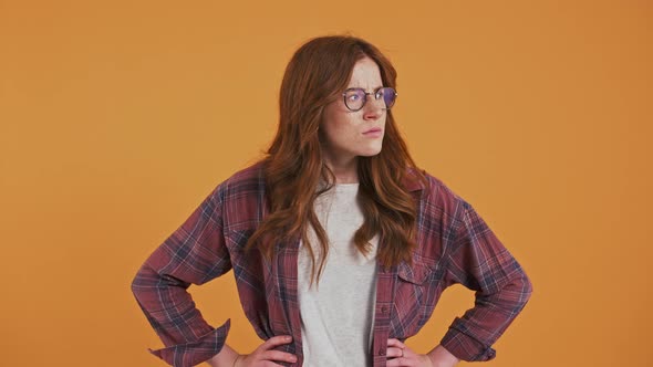 Redhaired Teenager in Checkered Shirt and Glasses
