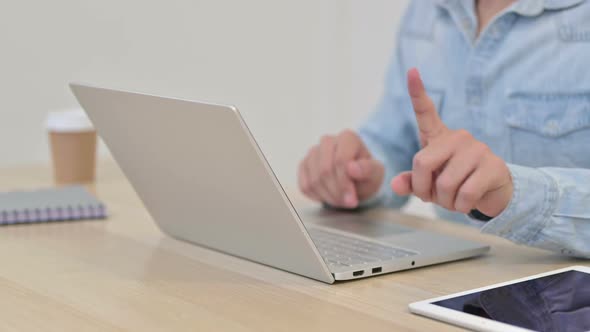 No Gesture By Man Typing on Laptop Close Up