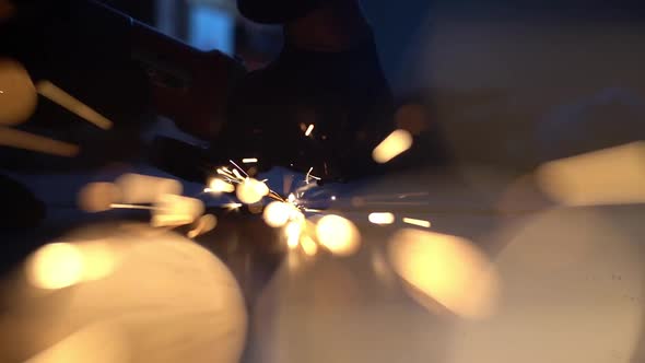 Abstract Sparks Fly From the Center of the Frame Into the Camera Lens