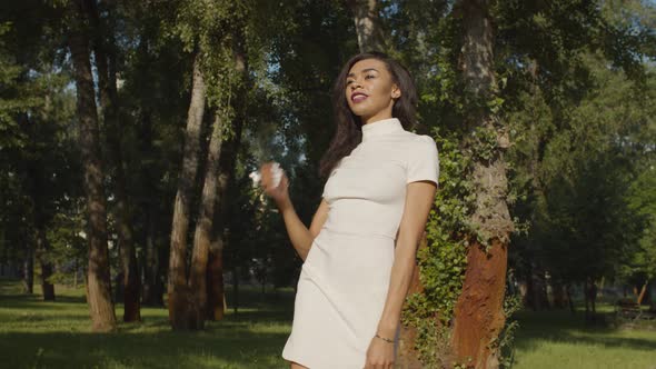 Confident Pretty Woman Walking in Public Park