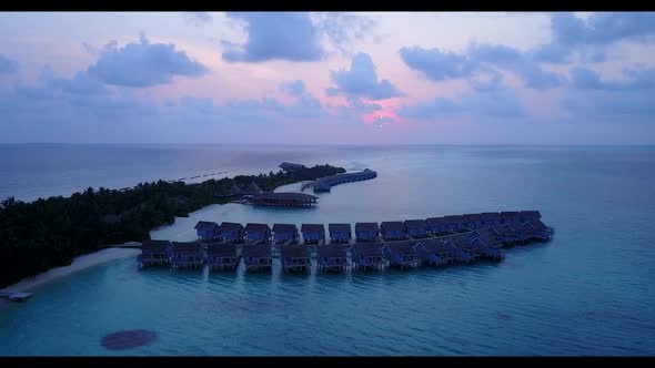 Aerial drone panorama of beautiful shore beach wildlife by blue ocean with white sand background of 