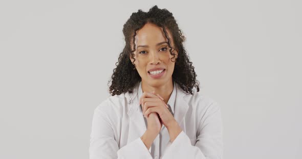 Video of portrait of smiling biracial female doctor holding hands and talking