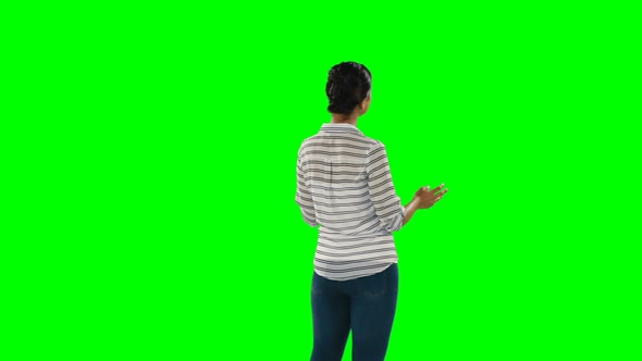 Woman giving a presentation against green screen 4k