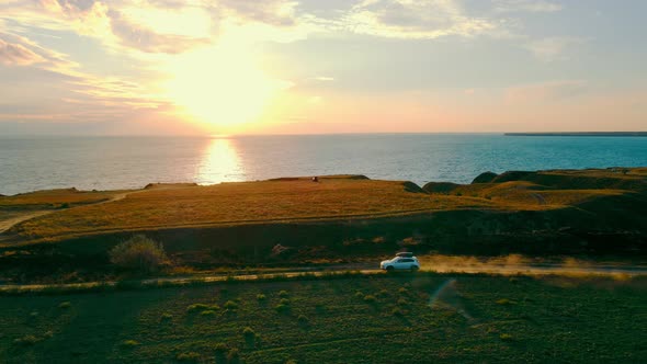 Travel By Car By the Sea at Sunset